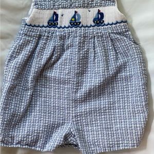 Romper with stitched sailboats.